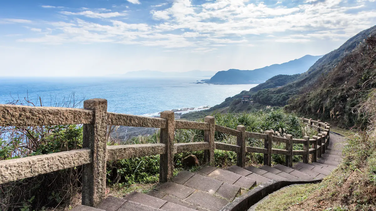 Coastal stone pathway overlooking the ocean symbolizing reflection forward movement healing and finding peace through lifes journey
