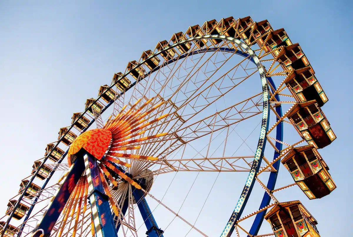 Colorful ferris wheel against a clear sky reflecting life transitions in depth oriented therapy annapolis