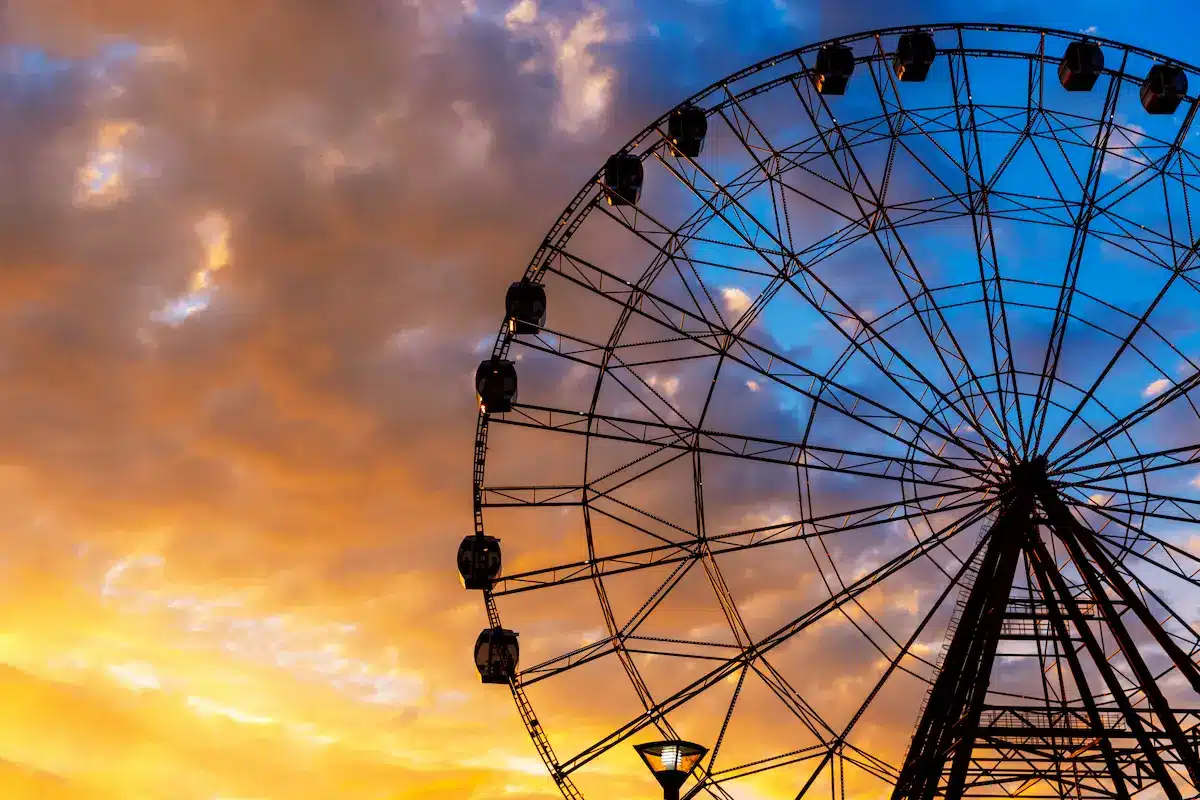 Ferris wheel against a colorful evening sky reflecting life transitions in depth oriented therapy annapolis