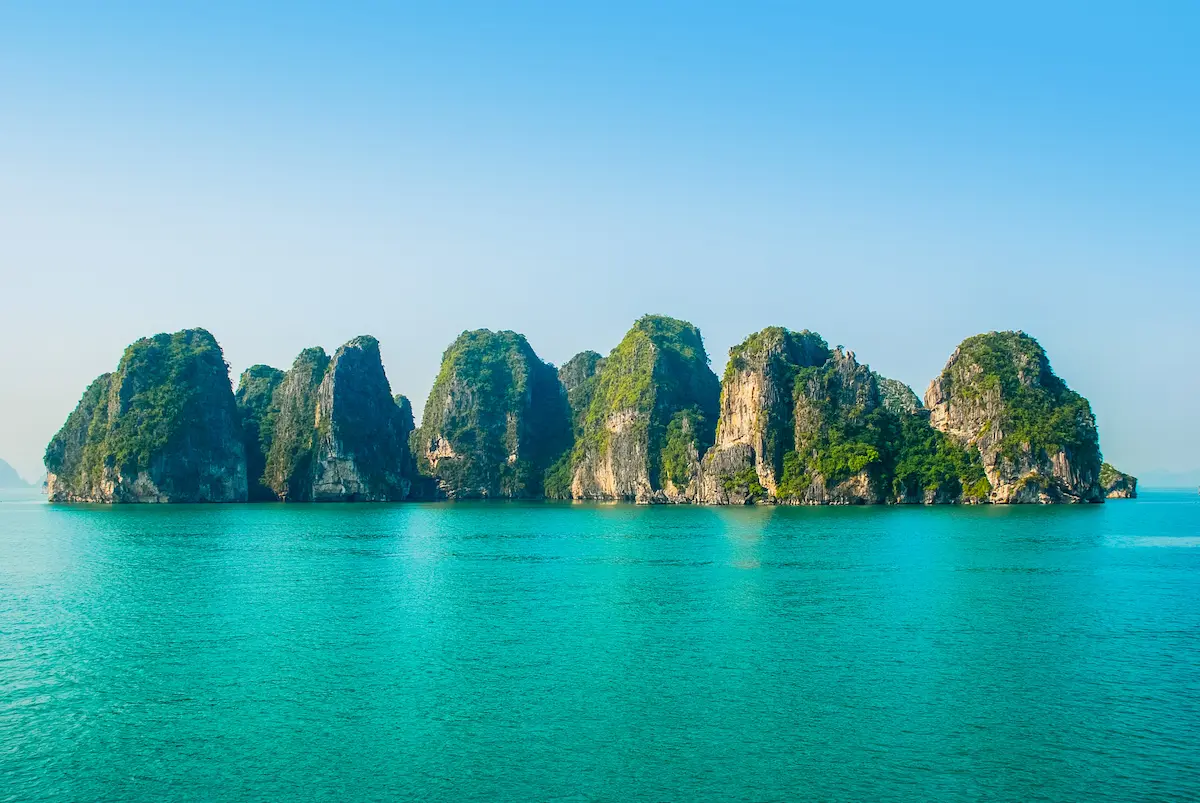Green limestone islands rising from turquoise water evoking calm reflection in depth oriented therapy annapolis