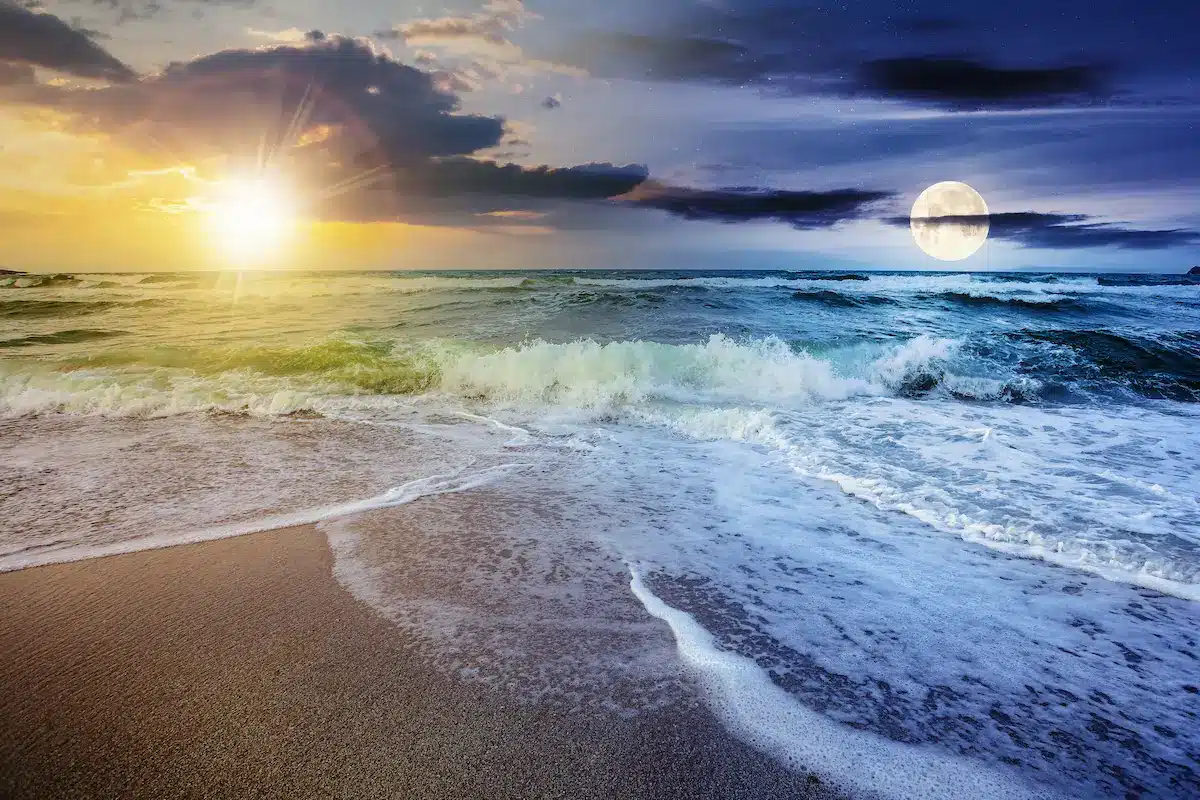 Ocean waves beneath sun and moonlit skies reflecting emotional balance in depth oriented therapy annapolis