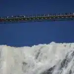 Suspension bridge above a powerful waterfall, reflecting resilience in depth-oriented therapy Annapolis